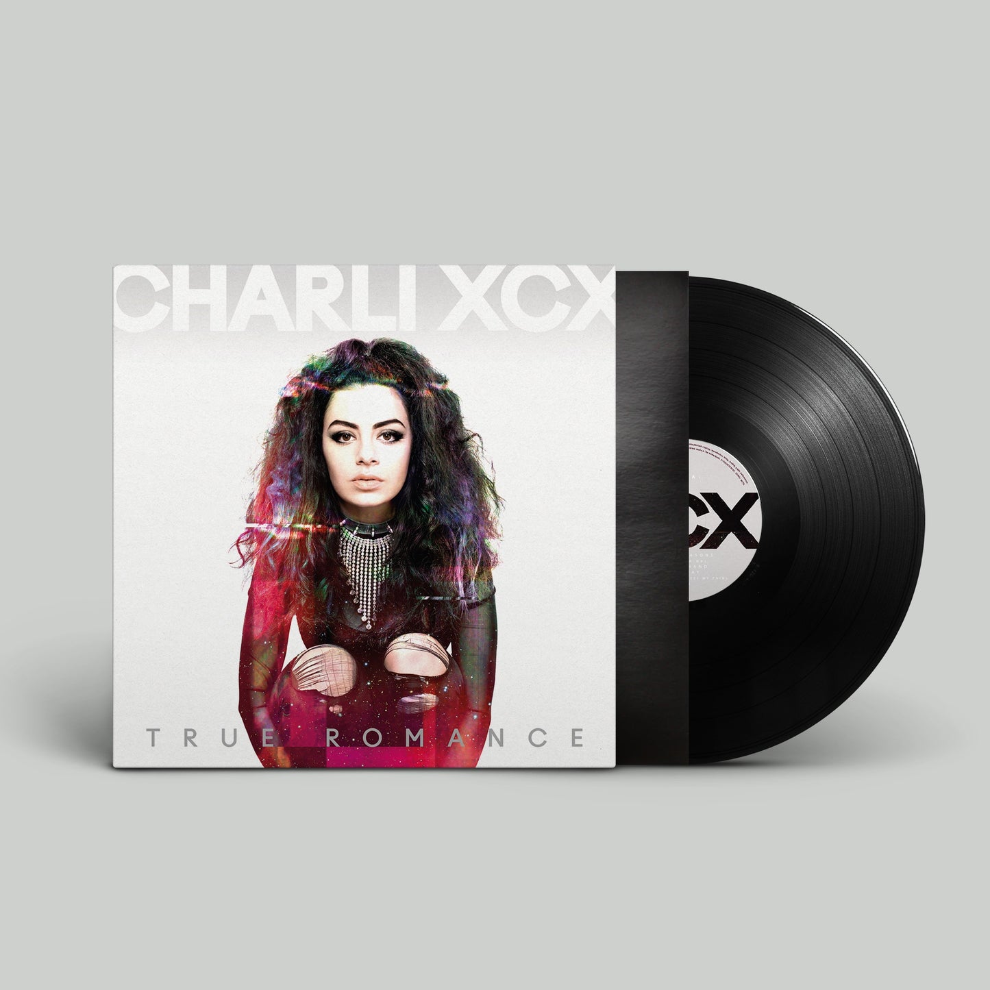 Charli XCX "True Romance" vinyl record and album cover featuring the artist.