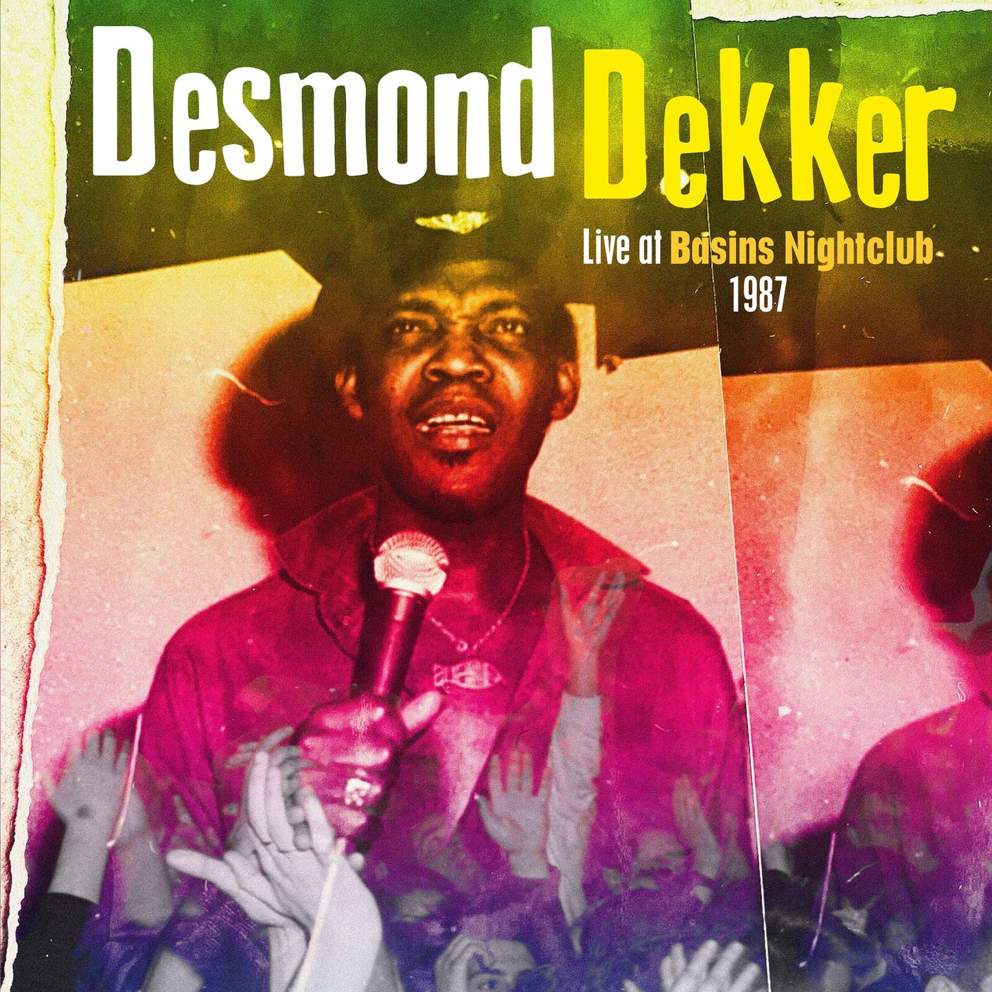 Desmond Dekker performing with a microphone, album cover for a 1987 live recording.