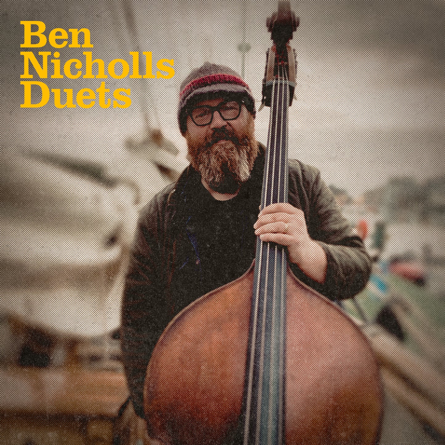 CD cover: Ben Nicholls with double bass, wearing glasses and a hat.