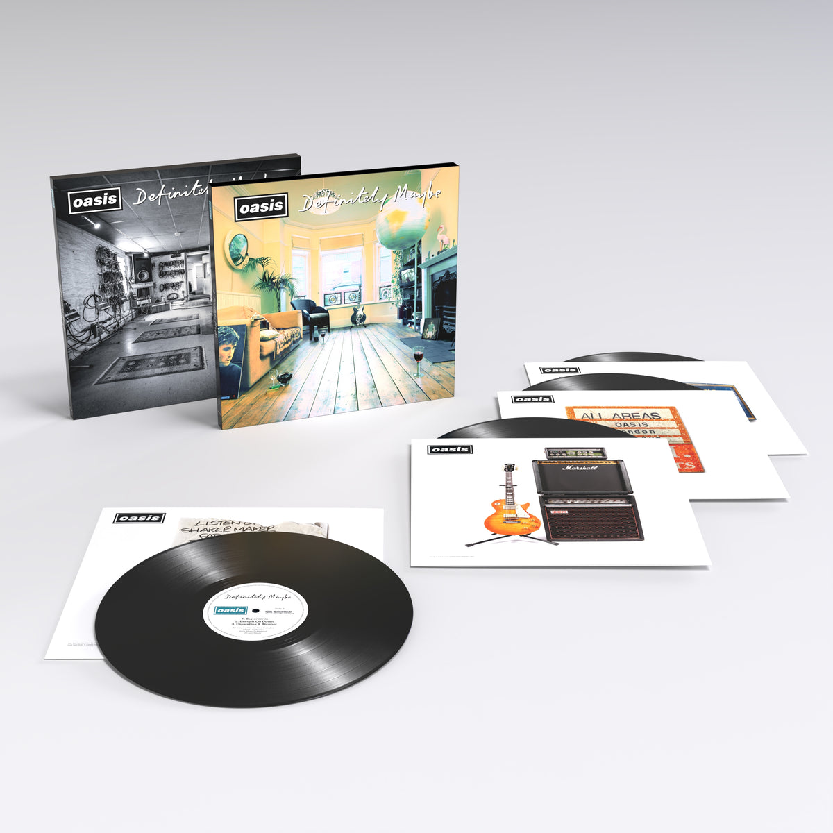 Oasis “Definitely Maybe” 30th anniversary vinyl record and accompanying inserts.