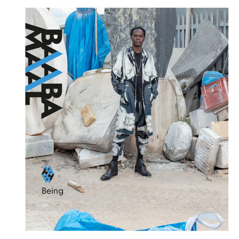 Album cover for Baaba Maal’s “Being” featuring a man in patterned clothing.