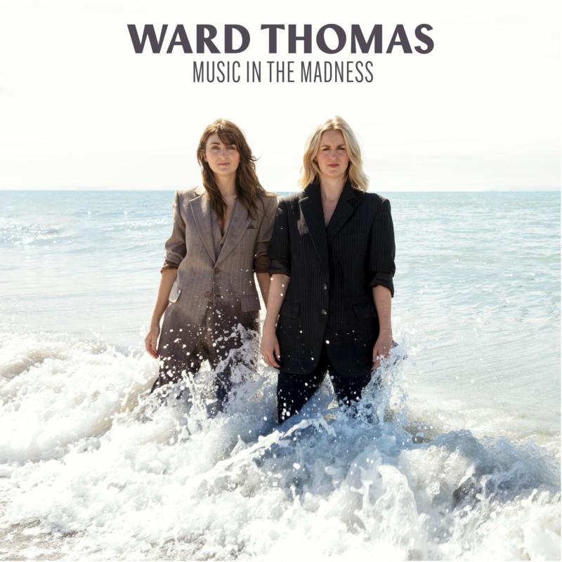 Ward Thomas album cover featuring two women waist-deep in ocean waves.