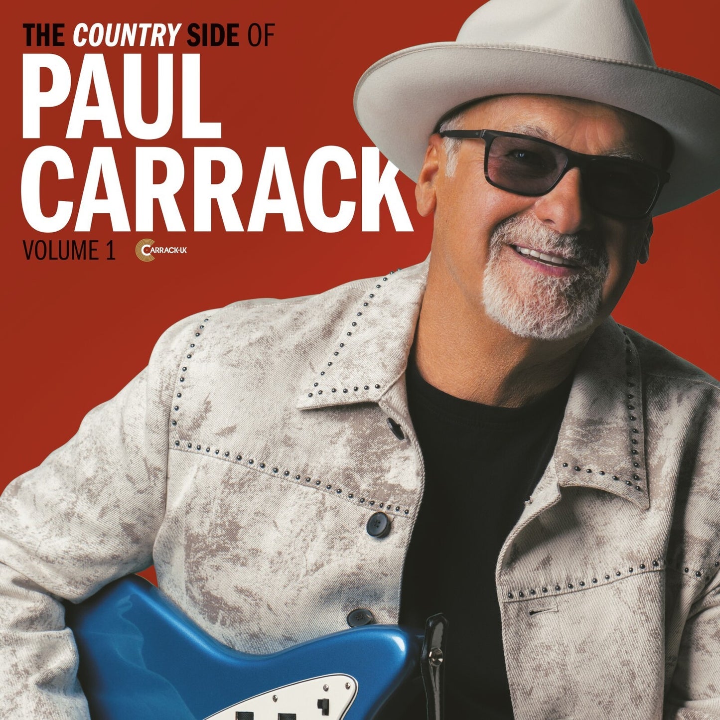 Paul Carrack album cover featuring artist with guitar and cowboy hat.