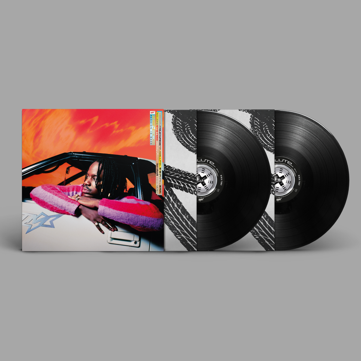 Vinyl record of Salute’s “True Magic” with portrait and black discs.