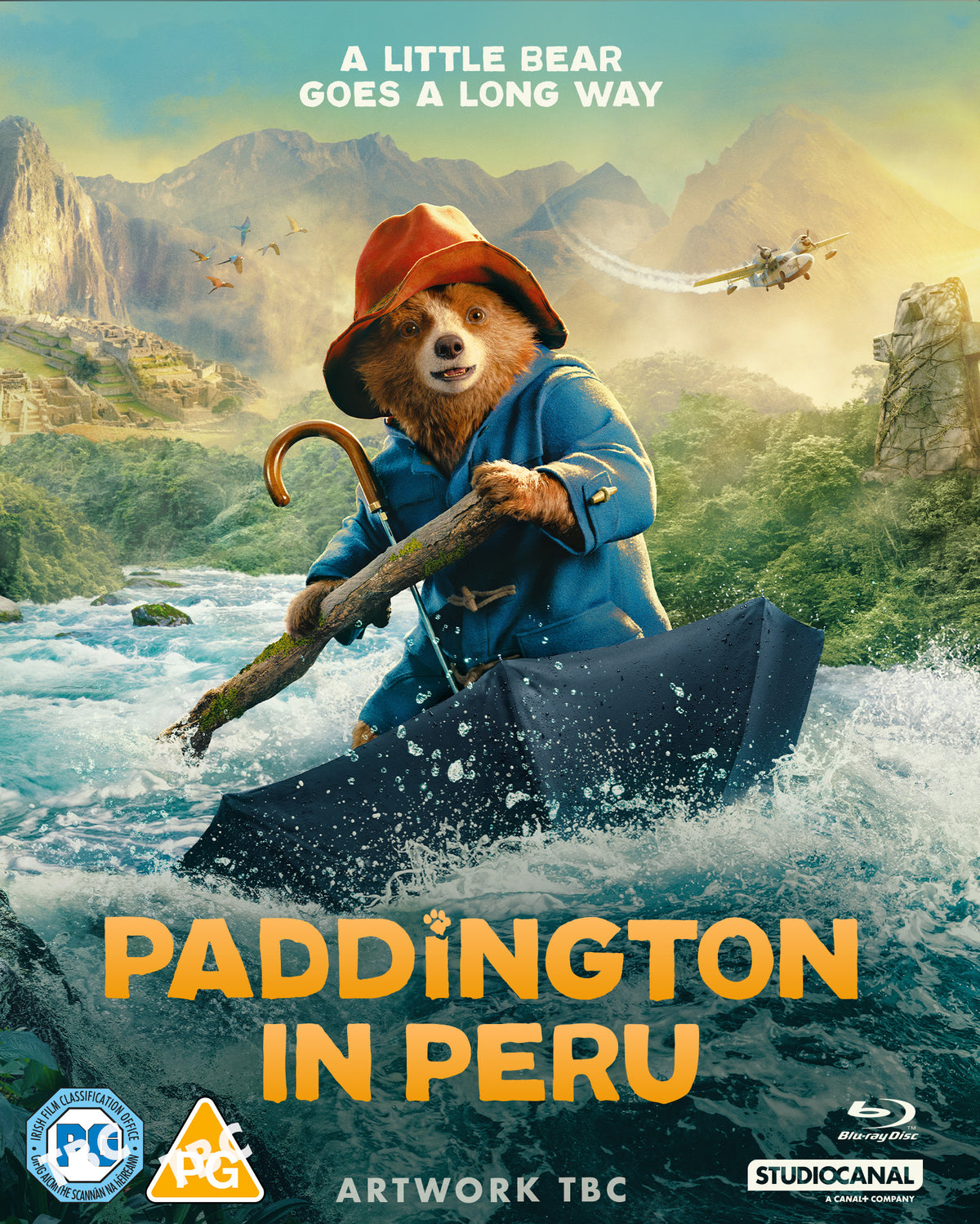 Paddington Bear rides a suitcase down a rushing river in Peru.