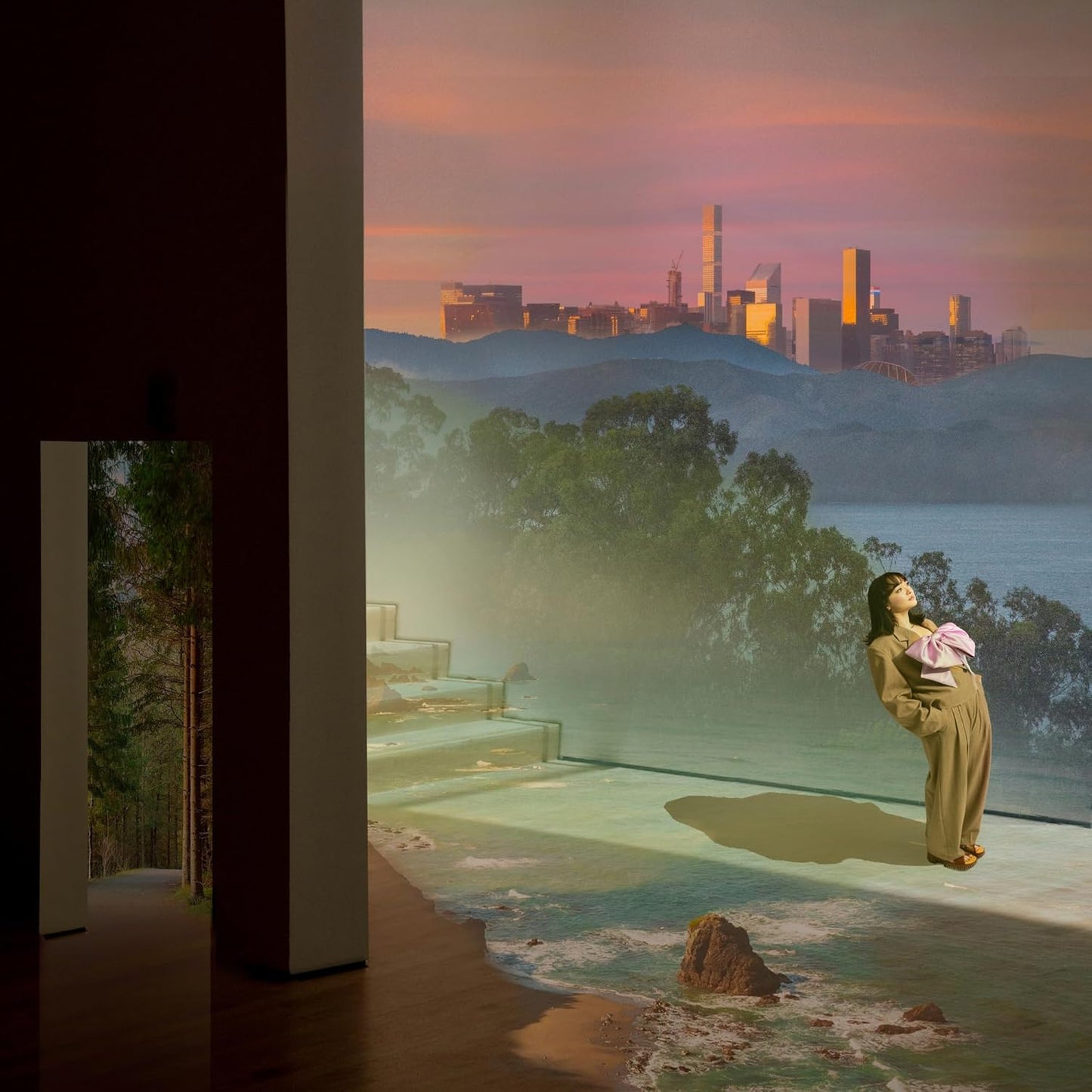 mxmtoon album cover: woman by water, city skyline, surreal landscape.