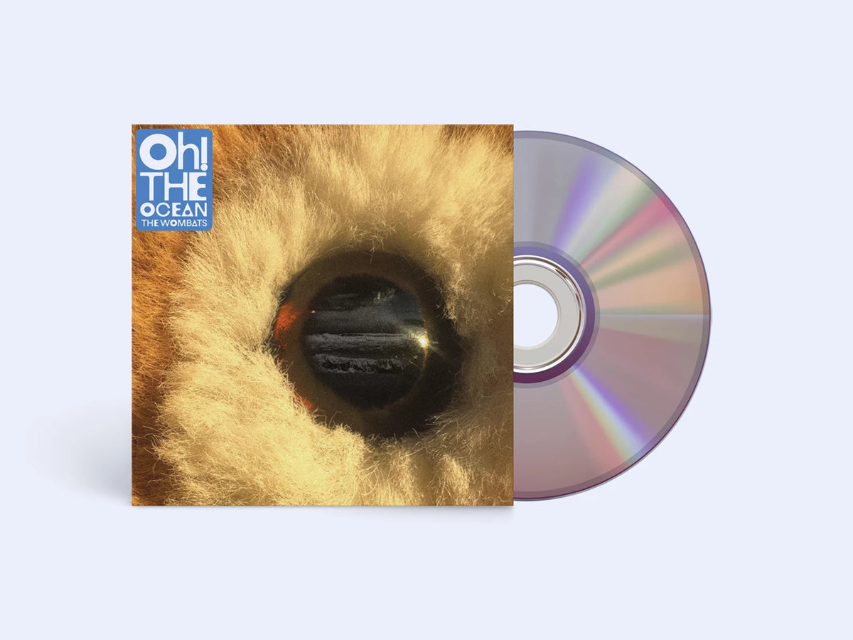 CD case with an eye image and a reflective disc beside it.