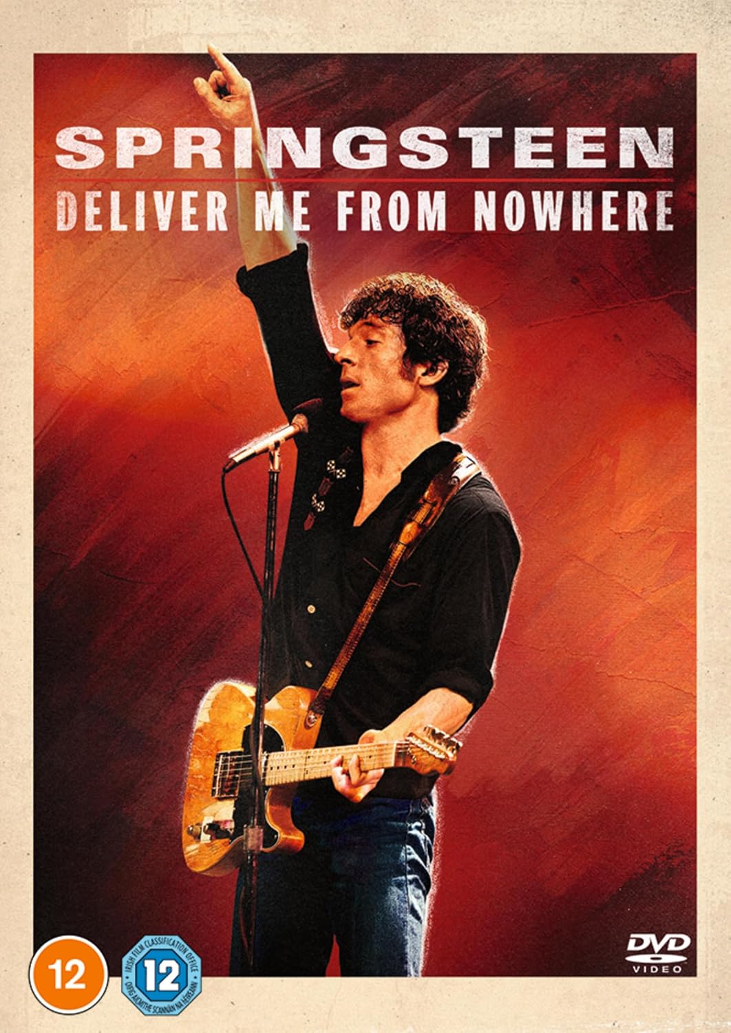 Bruce Springsteen playing guitar on DVD cover, warm sunset background.