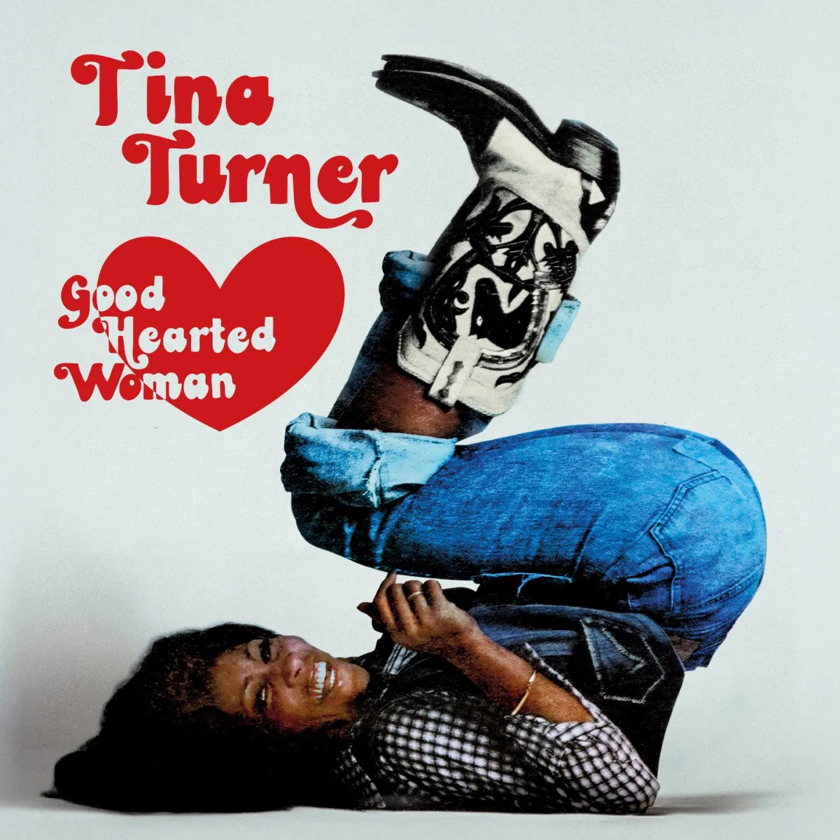 Tina Turner album cover: red heart, boots, and reclining figure.