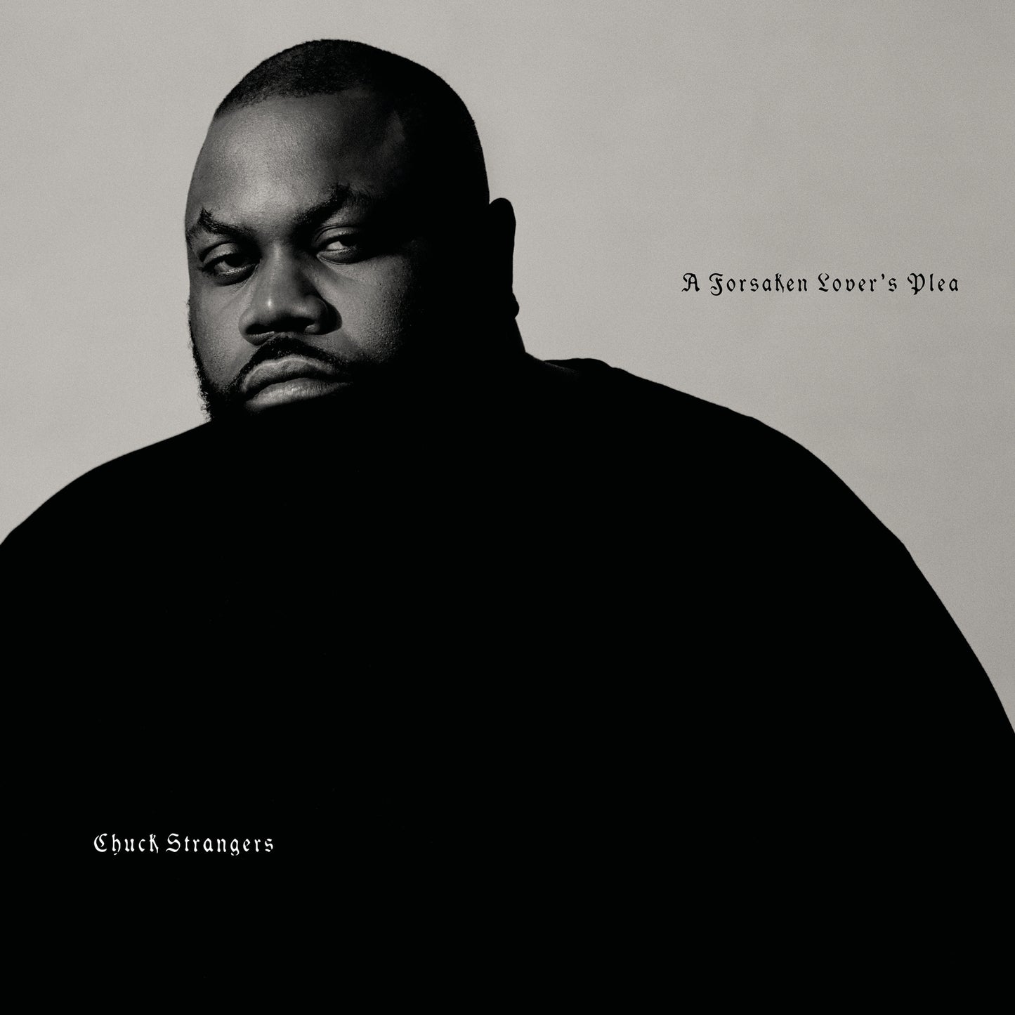 Black and white portrait of Chuck Strangers, album cover art.