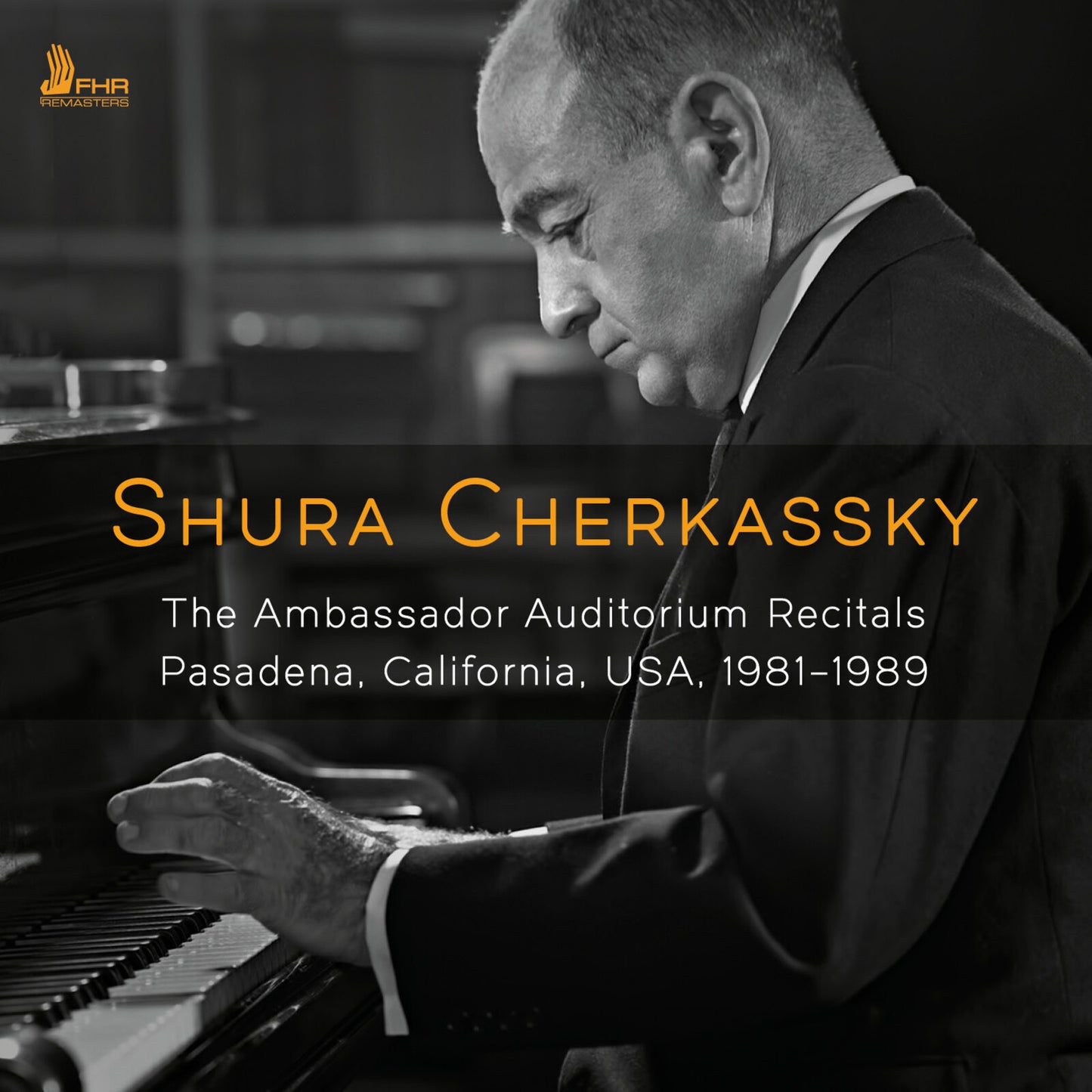 Black and white portrait of pianist Shura Cherkassky at a grand piano.