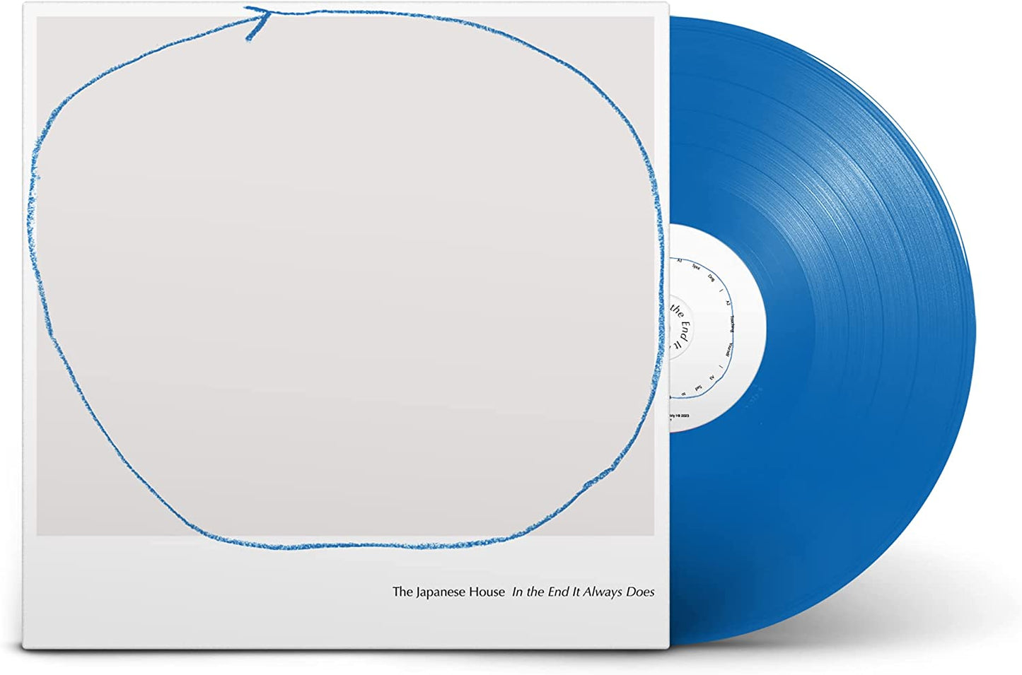 Blue vinyl record with a hand-drawn circle on the white album cover.
