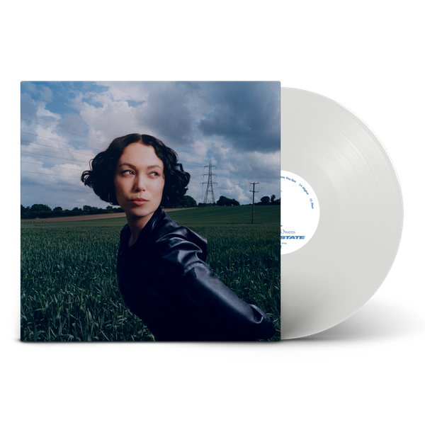 Kelly Lee Owens Dream State album cover art next to a white vinyl record.