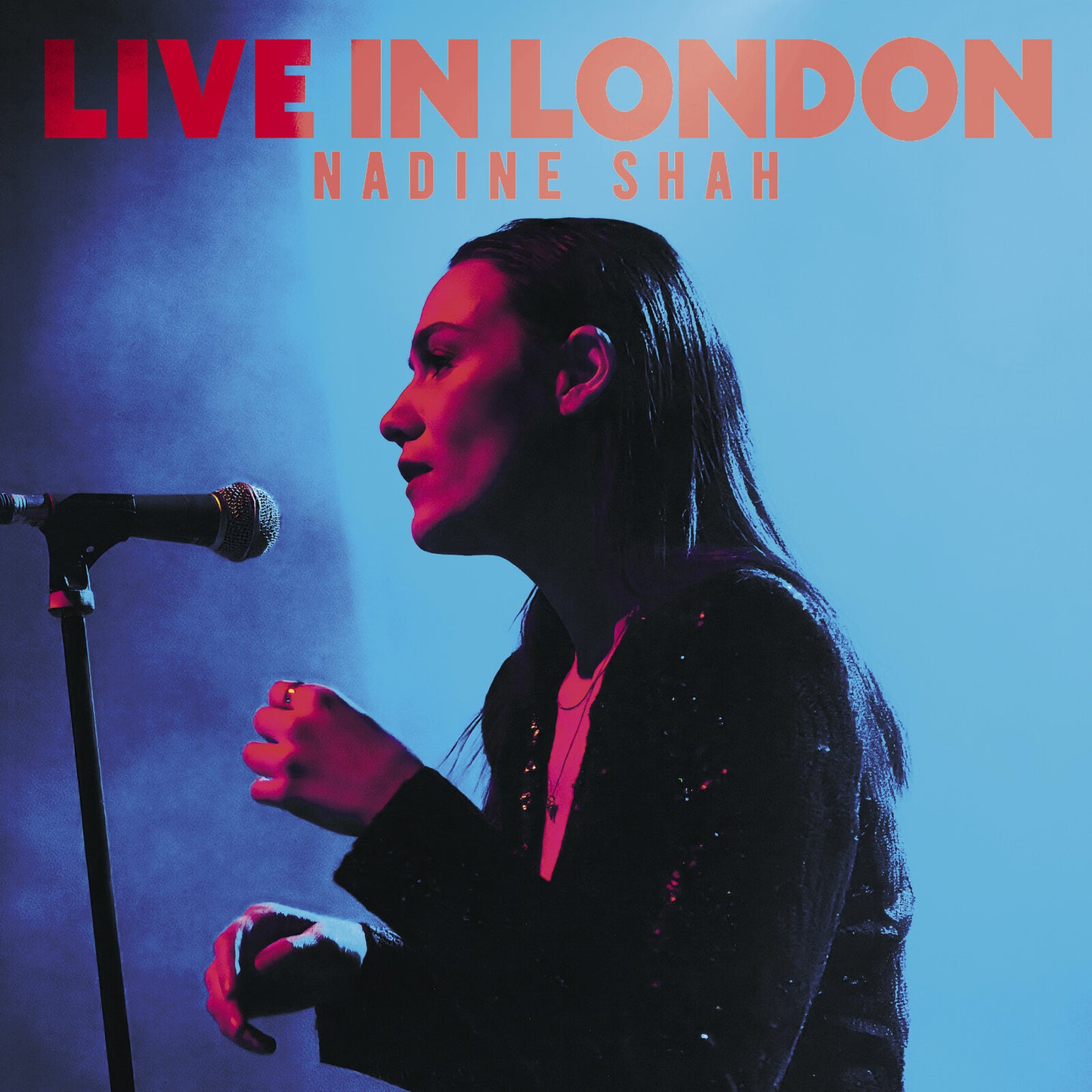 Nadine Shah album cover, singer at a microphone, red and blue tones.