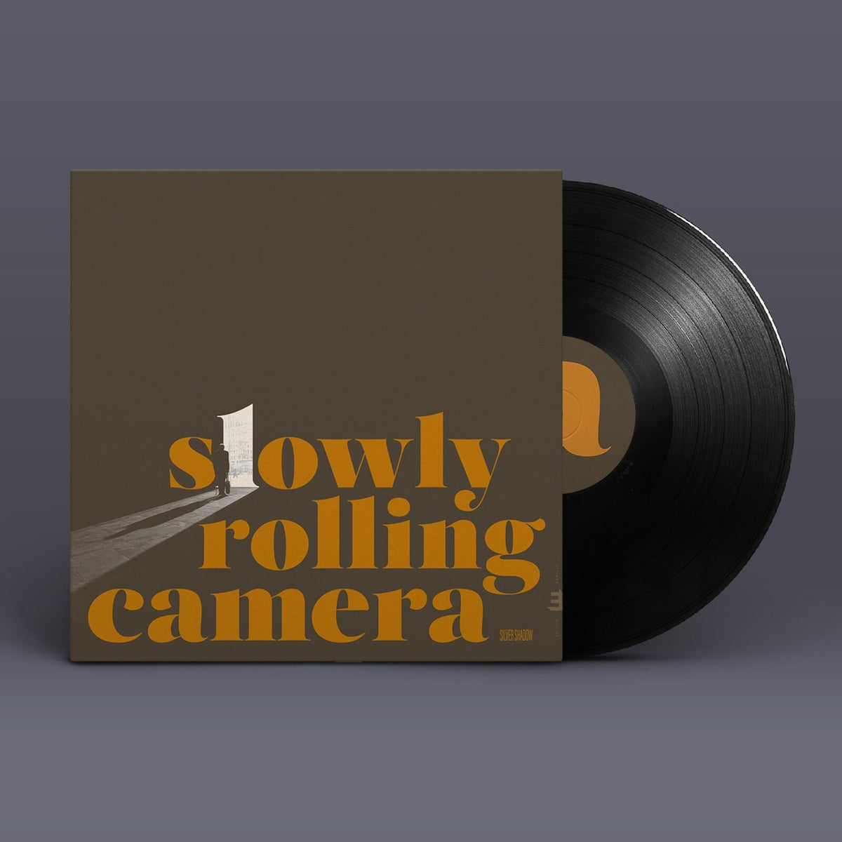 Vinyl record and album cover for "Slowly Rolling Camera - Silver Shadow".