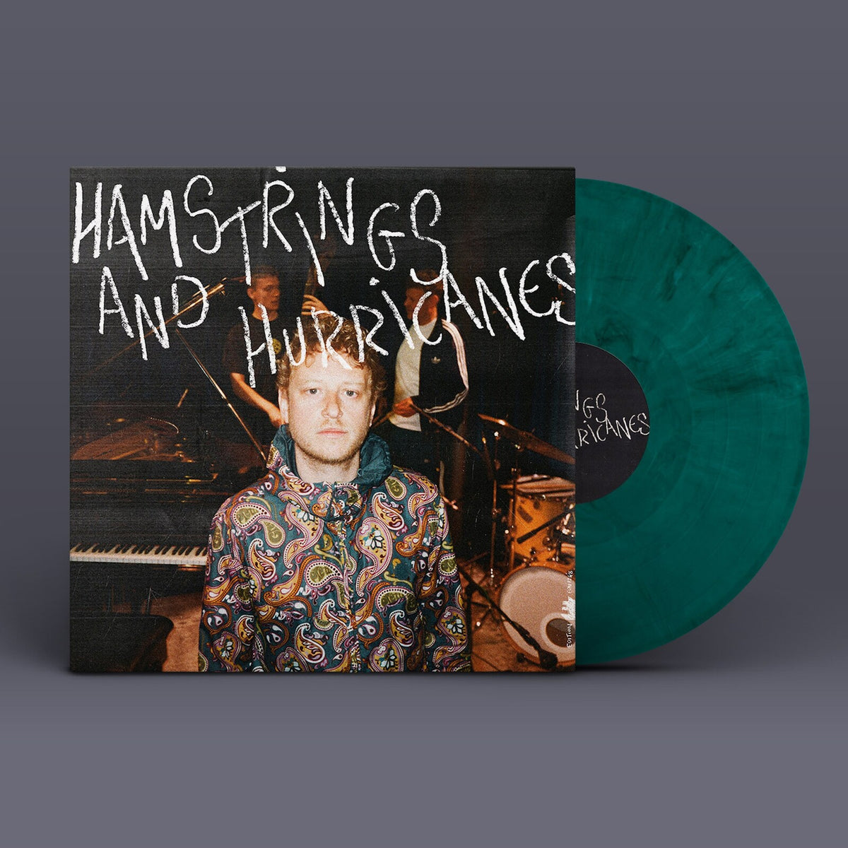 Vinyl record of Joe Webb’s “Hamstrings & Hurricanes” with green discs.