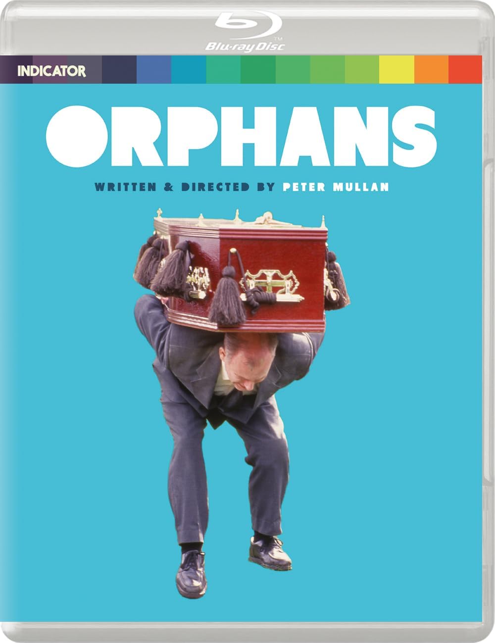 Orphans" Blu-ray cover featuring a man carrying a miniature house on his back.