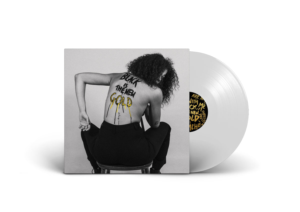 Vinyl record with a black and white portrait of a woman with gold text.