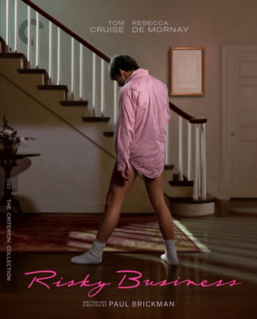 “Risky Business” Blu-ray cover: Tom Cruise in pink shirt sliding down stairs.