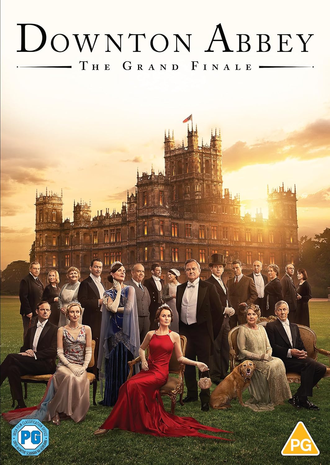 Downton Abbey cast portrait with the stately manor in the background.