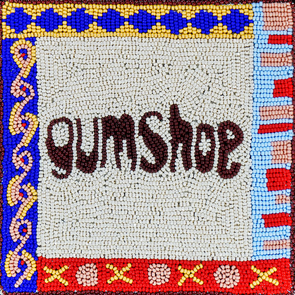 CD cover with beaded artwork spelling “Gumshoe” in dark lettering.
