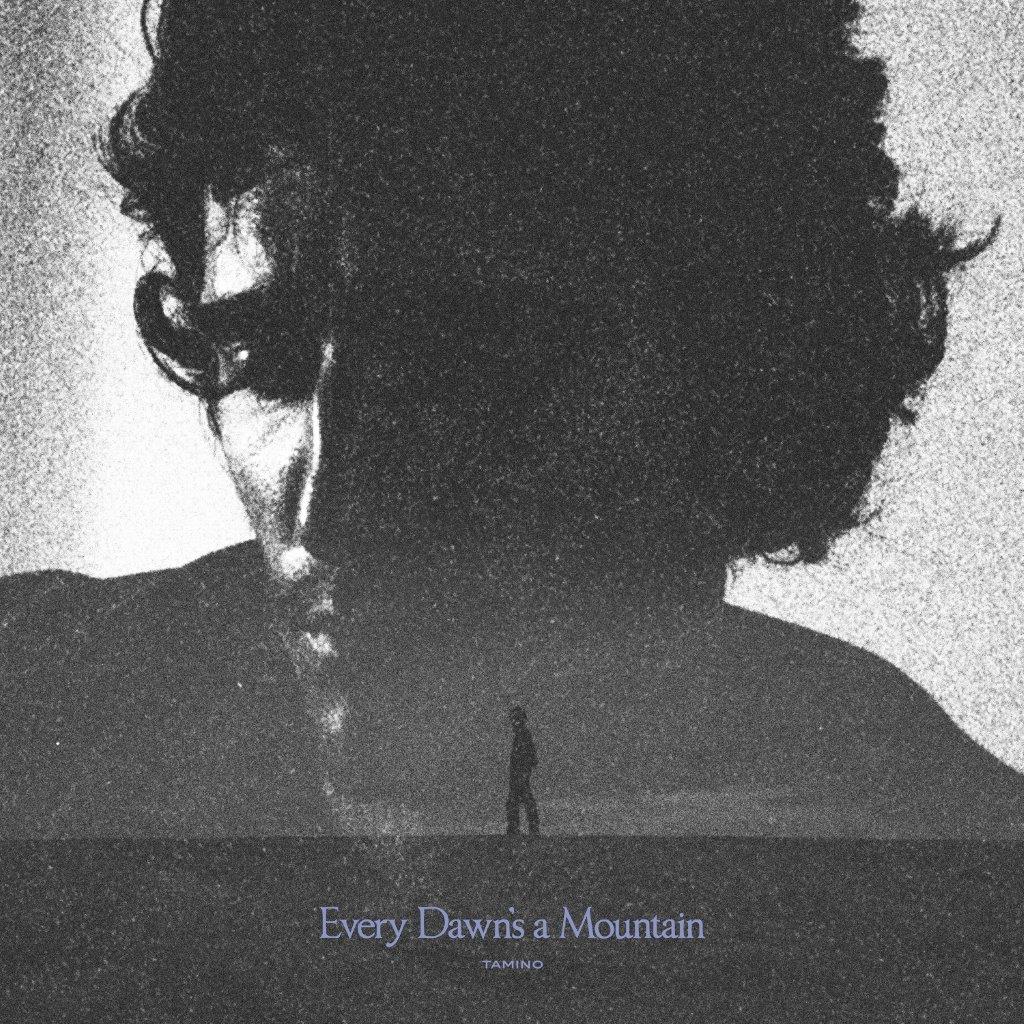 Black and white album cover featuring a man and a mountain silhouette.