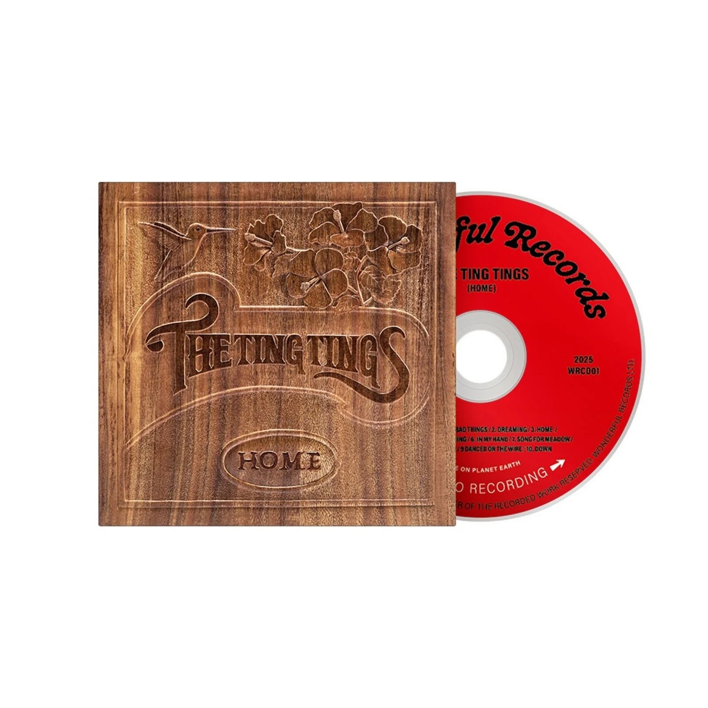 CD case for The Ting Tings’ “Home” album, featuring floral design.