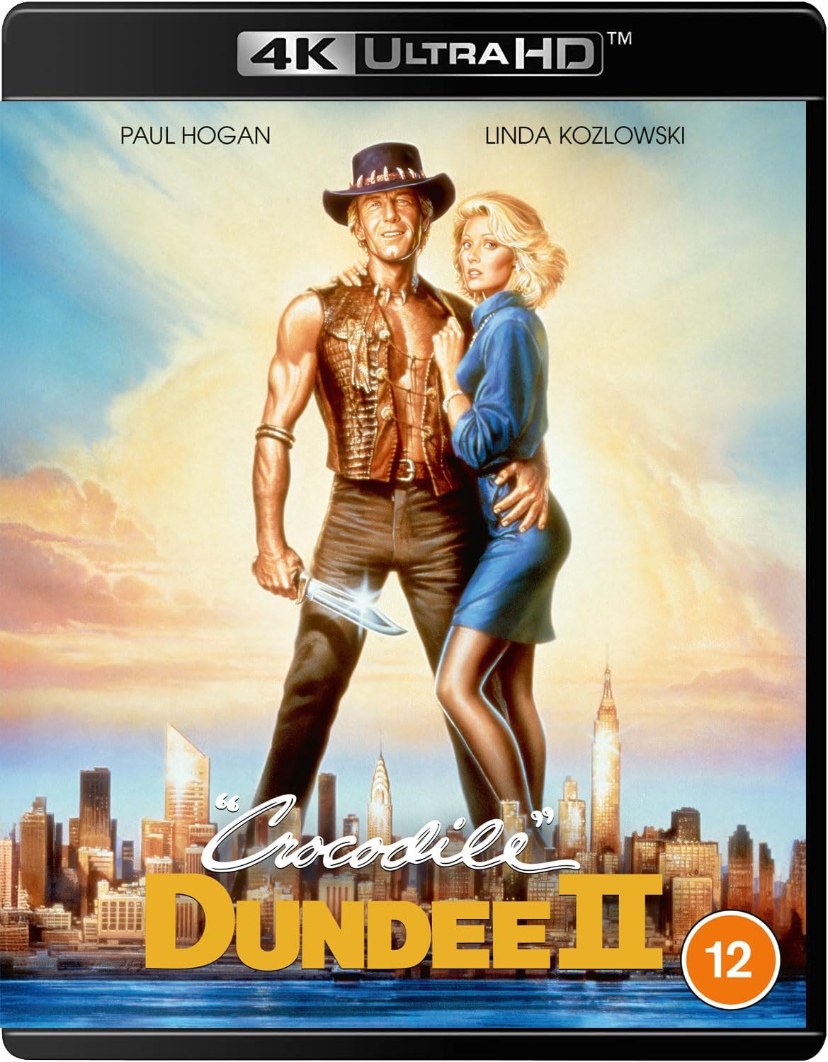 Blu-ray cover for Crocodile Dundee 2 featuring Paul Hogan and Linda Kozlowski.