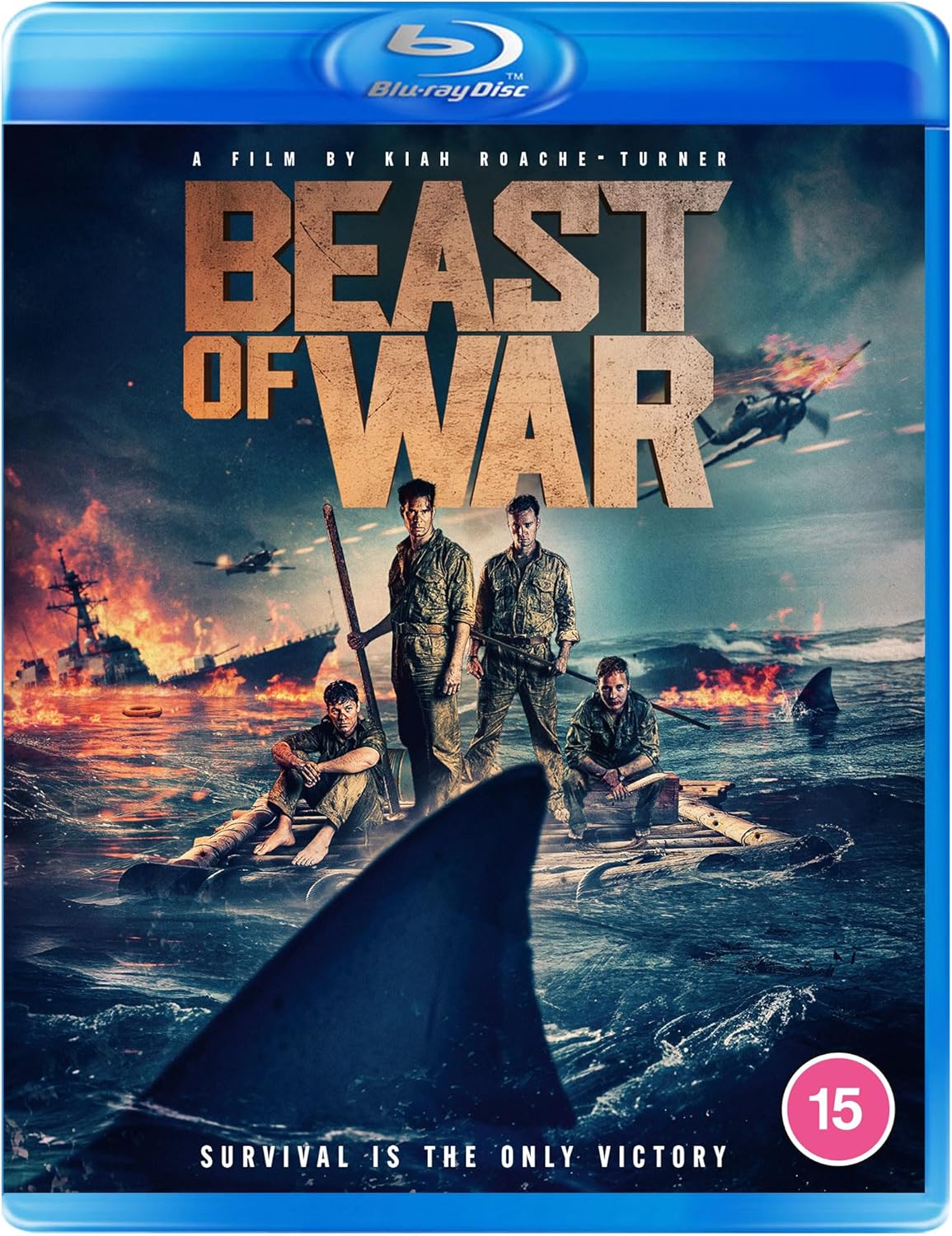 Four soldiers on a raft at sea with a shark fin in the foreground.