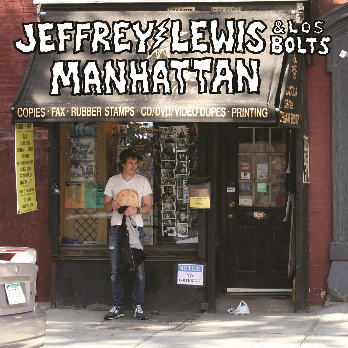 Album cover for Jeffrey Lewis & Los Bolts’ “Manhattan” featuring a street scene.