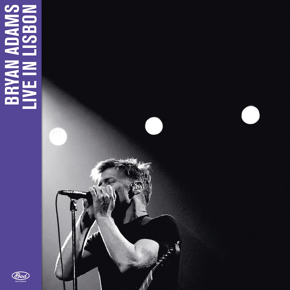 Bryan Adams live album cover: black and white photo, purple text.