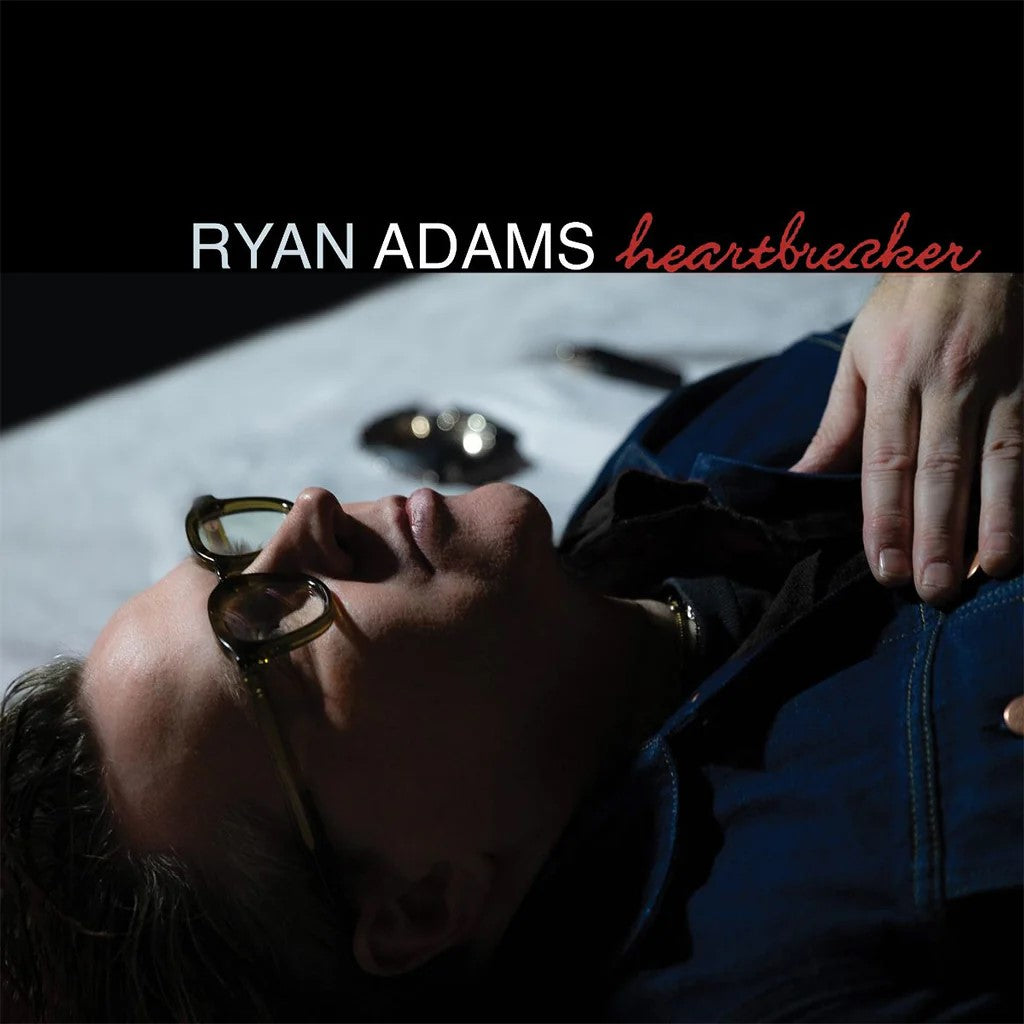 Ryan Adams “Heartbreaker” album cover featuring a shadowed portrait.