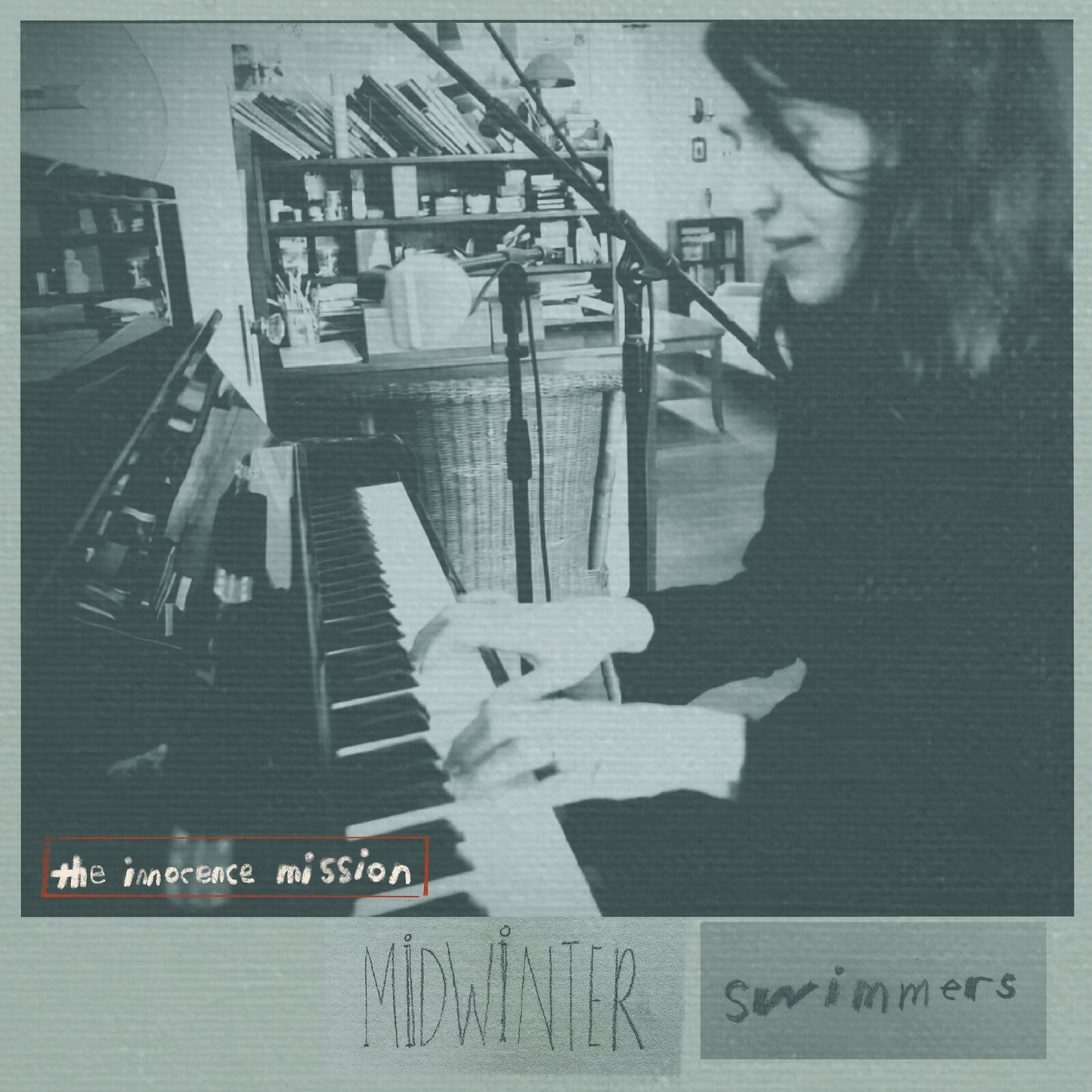 CD cover: woman with violin, piano, bookshelves, muted grayscale tones.