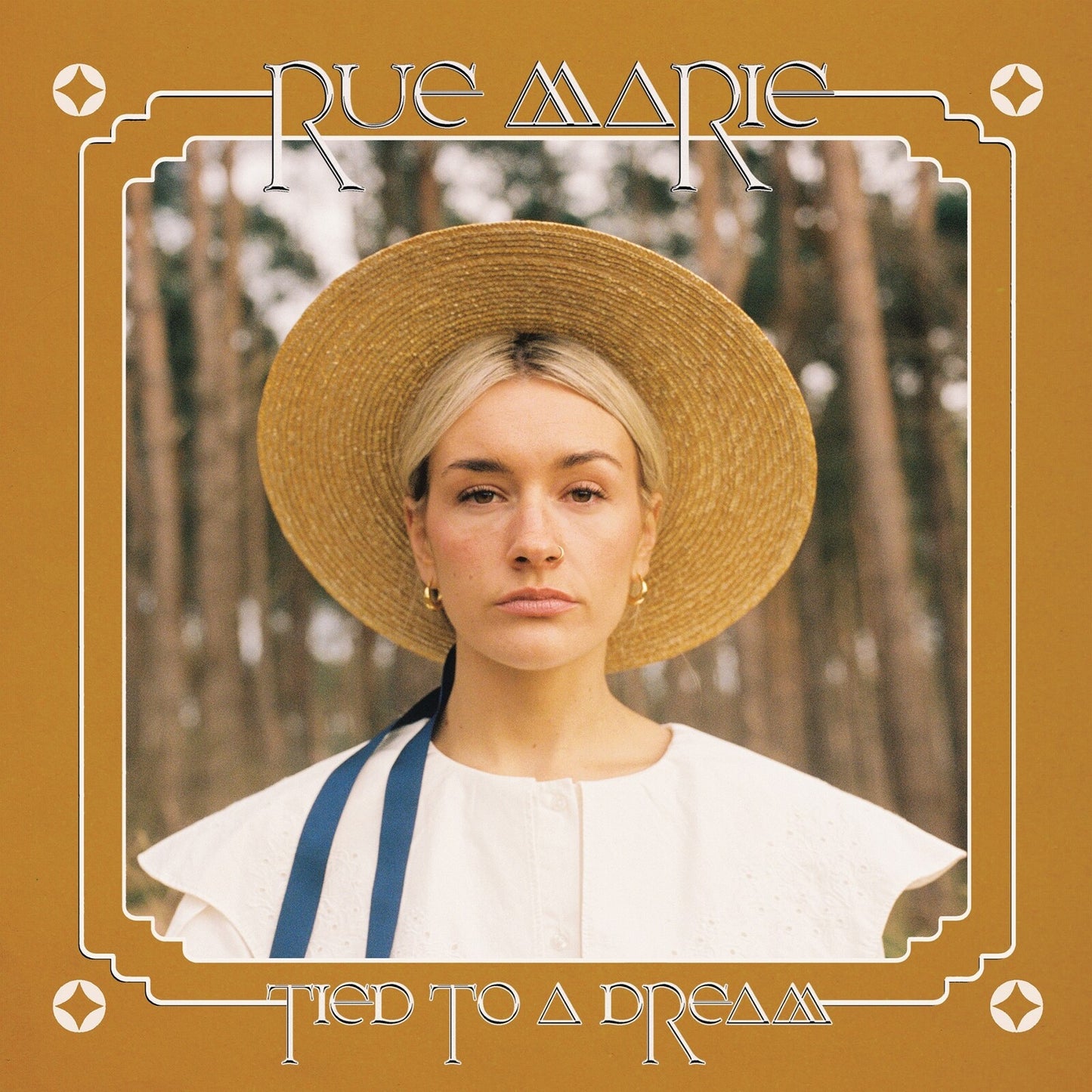 CD cover: woman in straw hat, forest background, gold frame.
