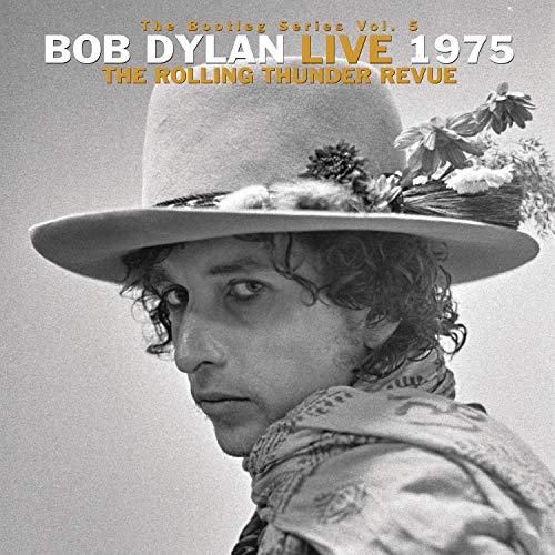 Bob Dylan in a hat with flowers, album cover for 1975 live recordings.