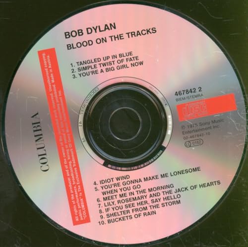 Bob Dylan’s “Blood On The Tracks” CD with tracklist and Columbia label.
