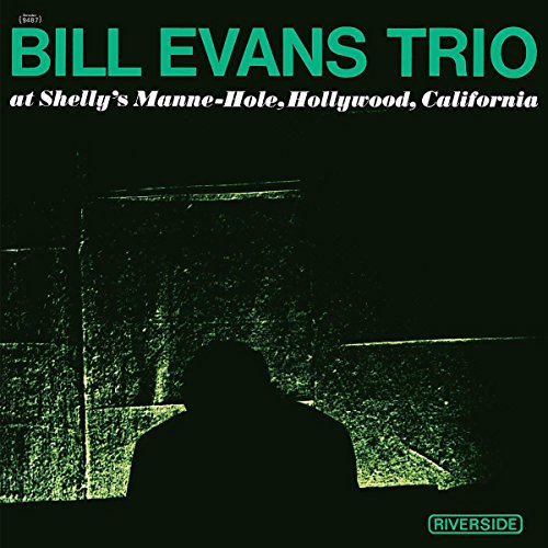 Bill Evans Trio album cover, dark green with a silhouetted figure.