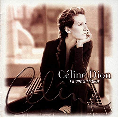 Céline Dion album cover, sepia toned, woman in a suit posing.