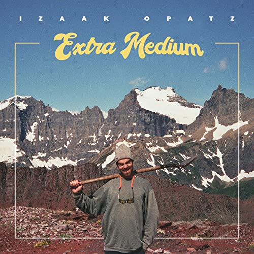 CD cover for Izaak Opatz’s “Extra Medium” featuring mountains and a man.
