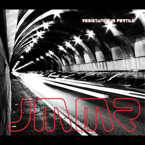 Tunnel interior with bright lights and red “JMMR” text overlay.