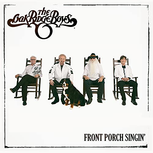 The Oak Ridge Boys and a dog sit in rocking chairs.
