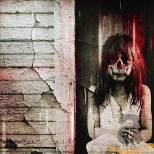 CD cover: woman with long hair peeking from a cracked wall.