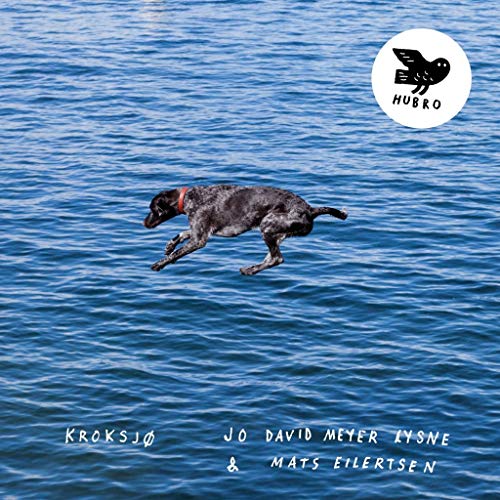 Dog leaping over blue water, album cover for "Kroksjø" vinyl record.