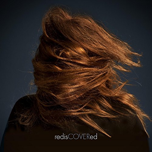 Album cover: woman with flowing brown hair, dark background, text "redisCOVERed".
