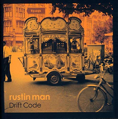 CD cover featuring an ornate street organ with a blurred city background.
