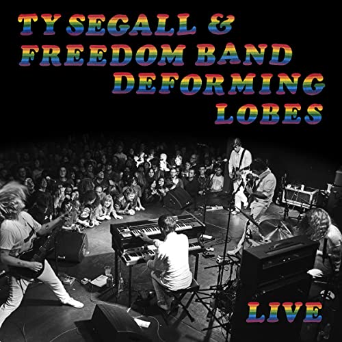 Ty Segall album cover: band performing live onstage, black and white photo.