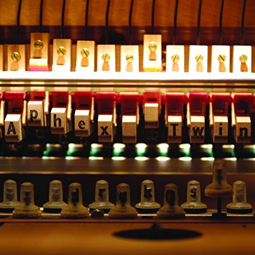 Close-up of a prepared piano mechanism spelling "Aphex Twin".