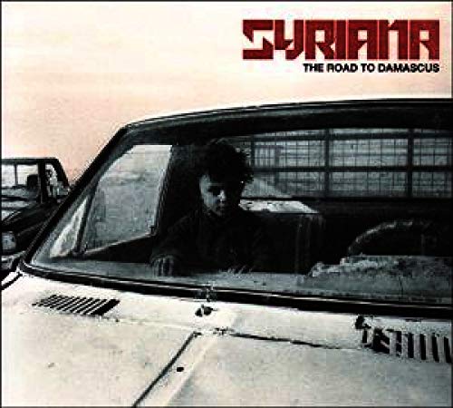 CD cover for "Syriana" featuring a man seen through a car window.