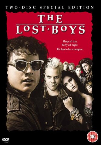DVD cover for The Lost Boys featuring a group of young people on red background.