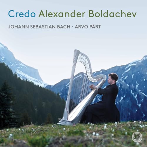 CD cover: Harpist playing in a snowy mountain landscape.
